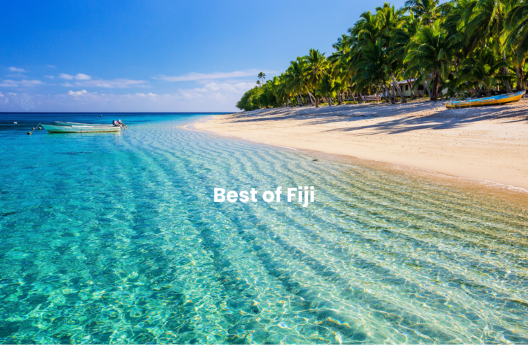 Best of Fiji image of the crystal clear water and a boat near the sandy beach